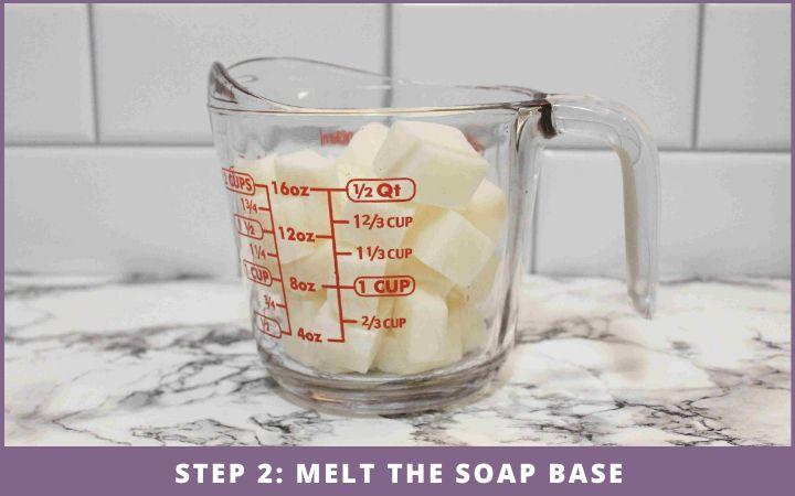 measuring jar with cubes of melt and pour soap base