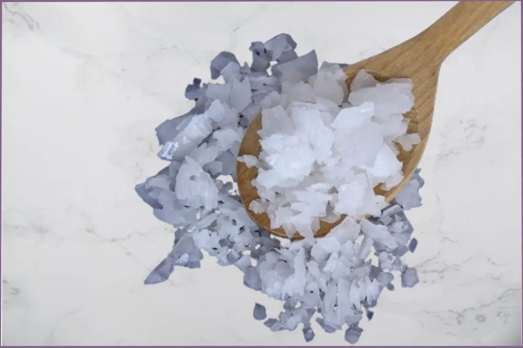 magnesium flakes in a wooden spoon