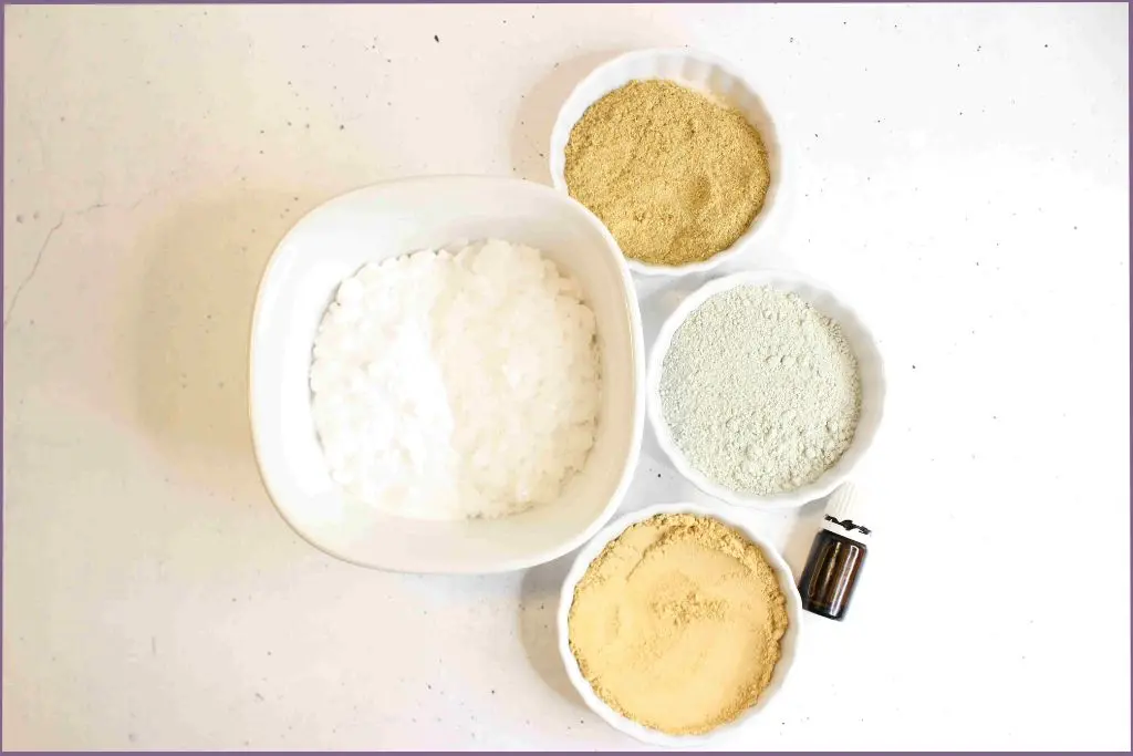 4 bowls with different powders to make bentonite clay detox bath powder