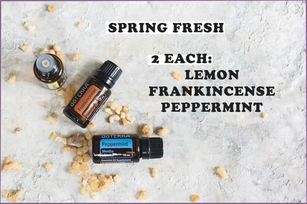 bottles of lemon, frankincense, and peppermint essential oils