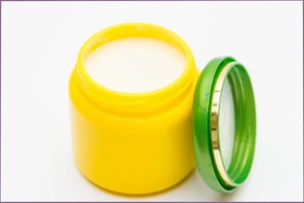 yellow container with skin care lotion