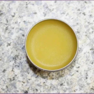 small round container with homemade lip balm