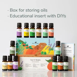 14 essential oil bottles in a display setting