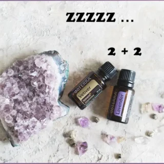 2 essential oil bottles - lavender and vetiver - to create deep sleep diffuser blend