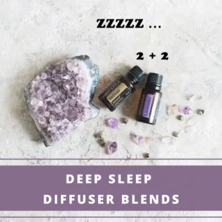 2 essential oil bottles - lavender and vetiver - to create deep sleep diffuser blend