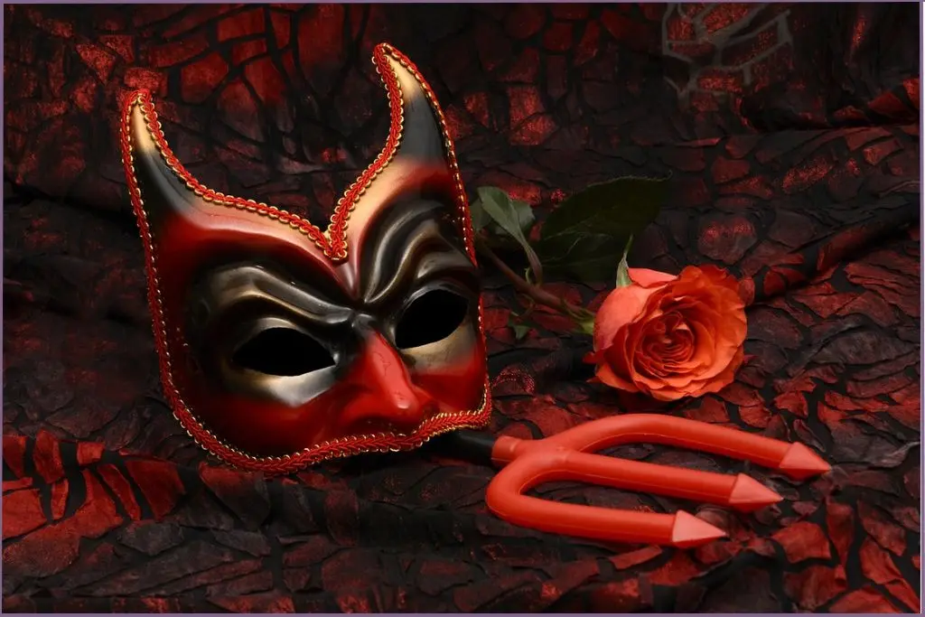 devil mask and trident against red and black background-Devils Delight essential oil blend