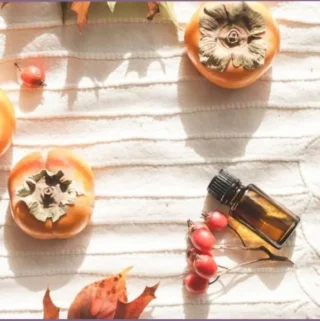 essential oil bottle on damask cloth
