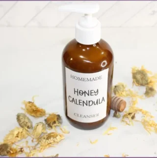glass pump bottle with homemade honey calendula face wash