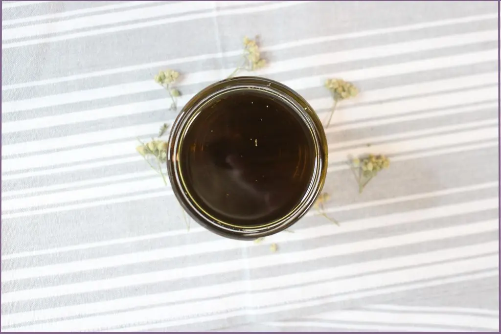 bottle of homemade yarrow infused oil - how to use yarrow oil for skin