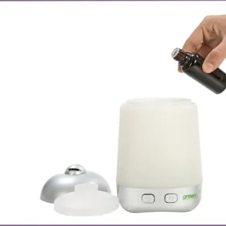 adding essential oil to a diffuser