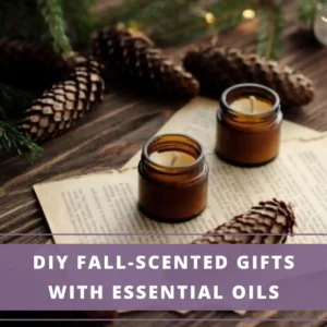 2 candles in glass jars surrounded by pinecones-DIY fall scented gift ideas