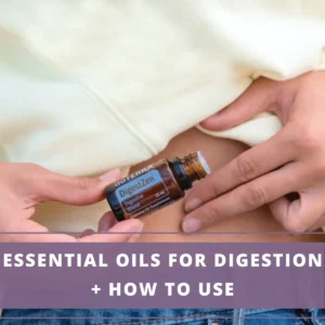 lady putting essential oil around her tummy area