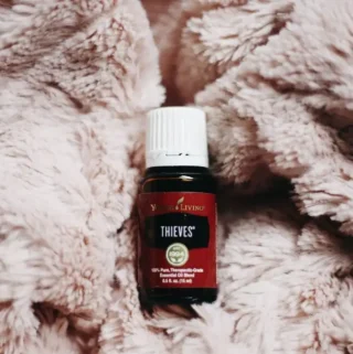 thieves oil bottle on soft blanket