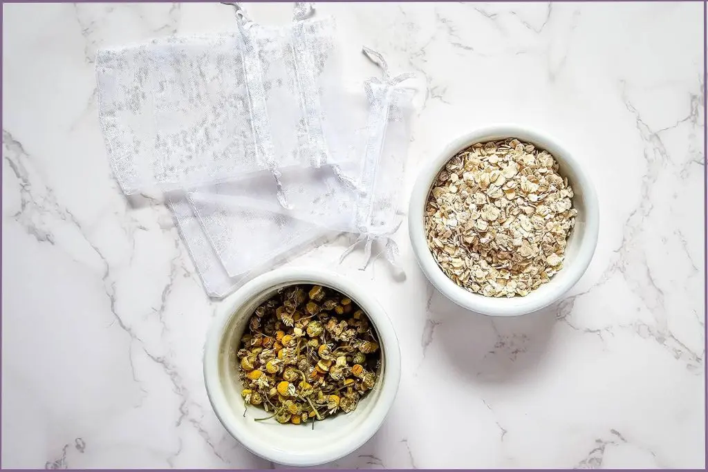 2 bowls with oatmeal and chamomile for making homemade herbal bath tea bags