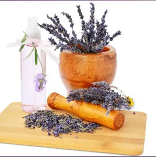 mortar and pestle with lavender flowers to make lavender hydrosol