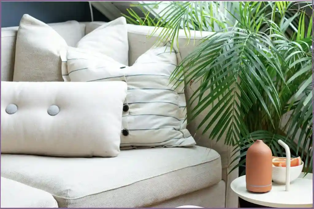 essential oil diffuser on table near a white couch