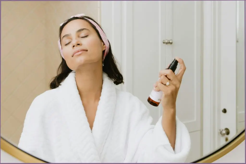 lady spritzing refreshing face mist made with cooling essential oils for summer
