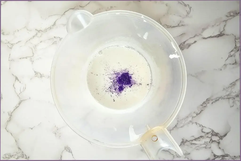 Purple mica color in melted soap base to make Halloween melt and pour soap bars