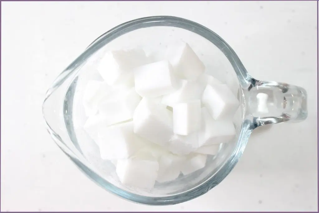 Goats milk soap base cut into small cubes and put into a heatproof glass measuring jar
