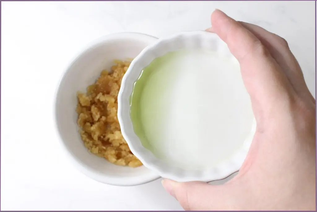 Pour carrier oil into honey-sugar mix - How to make honey lip scrub