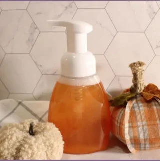 Pump bottle filled with DIY fall foaming hand soap with essential oils