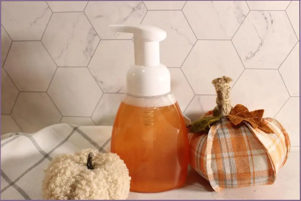 Pump bottle filled with DIY fall foaming hand soap with essential oils