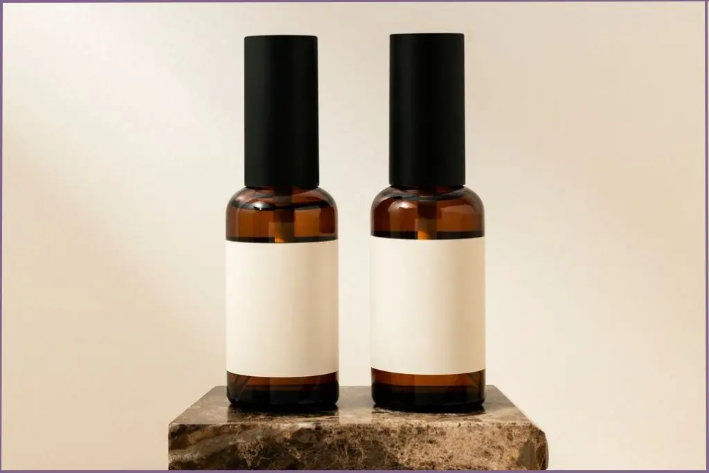 two small dark-glass spray bottles for DIY fall room sprays with essential oils