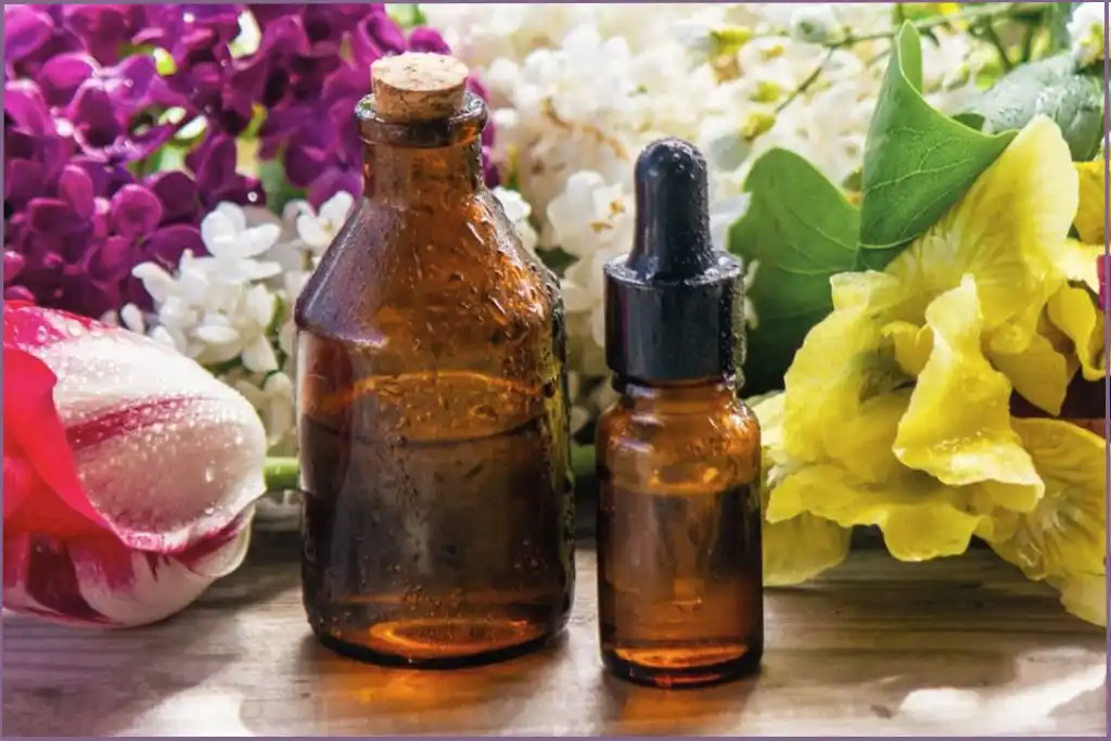 carrier oil and essential oil bottle to understand the differences between essential oils vs carrier oils