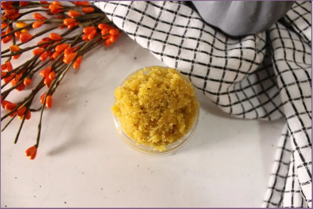 glass jar with DIY pumpkin spice body scrub + how to use