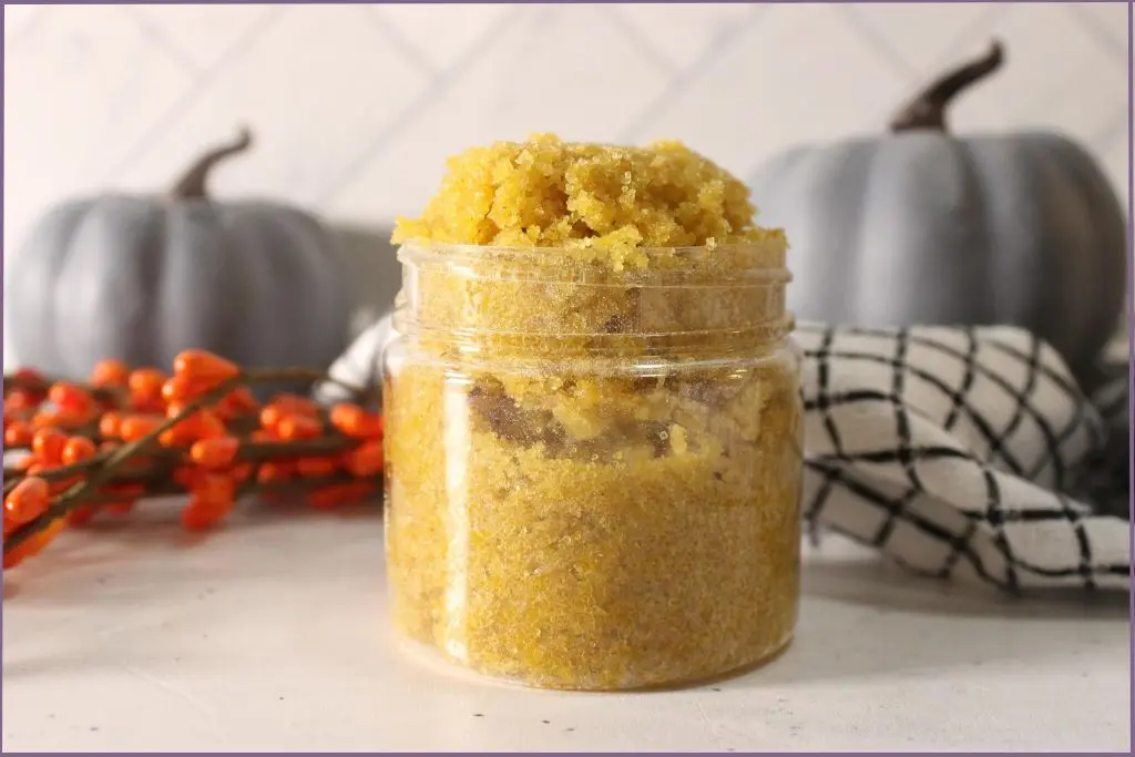 glass jar with homemade pumpkin spice body scrub