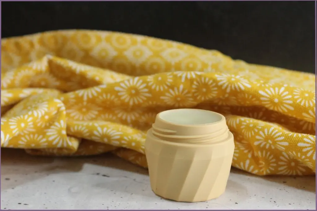 small balm container filled with DIY cuticle balm with shea butter- FAQs