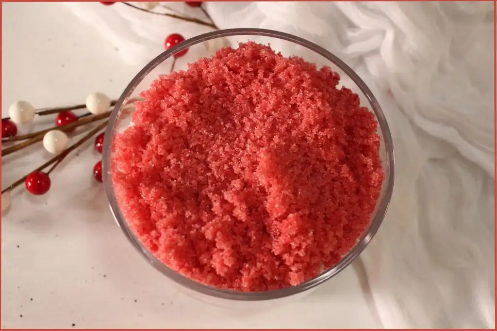 Top view of DIY candy cane sugar scrub in glass
