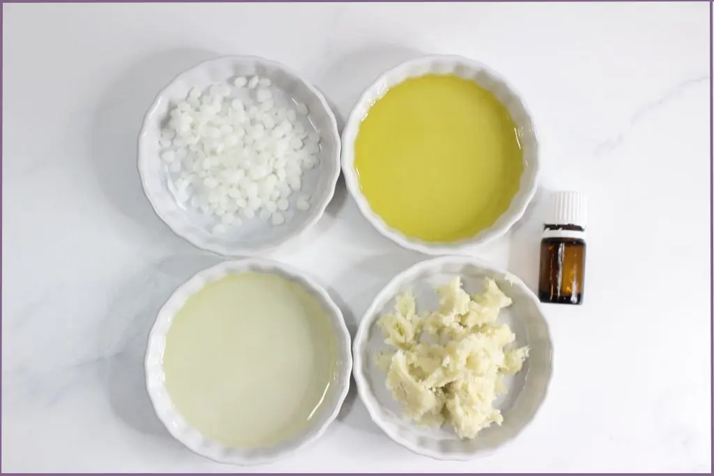 Ingredients for homemade cuticle balm with shea butter- 4 bowls with shea butter, argan oil, beeswax pellets, and jojobas oil