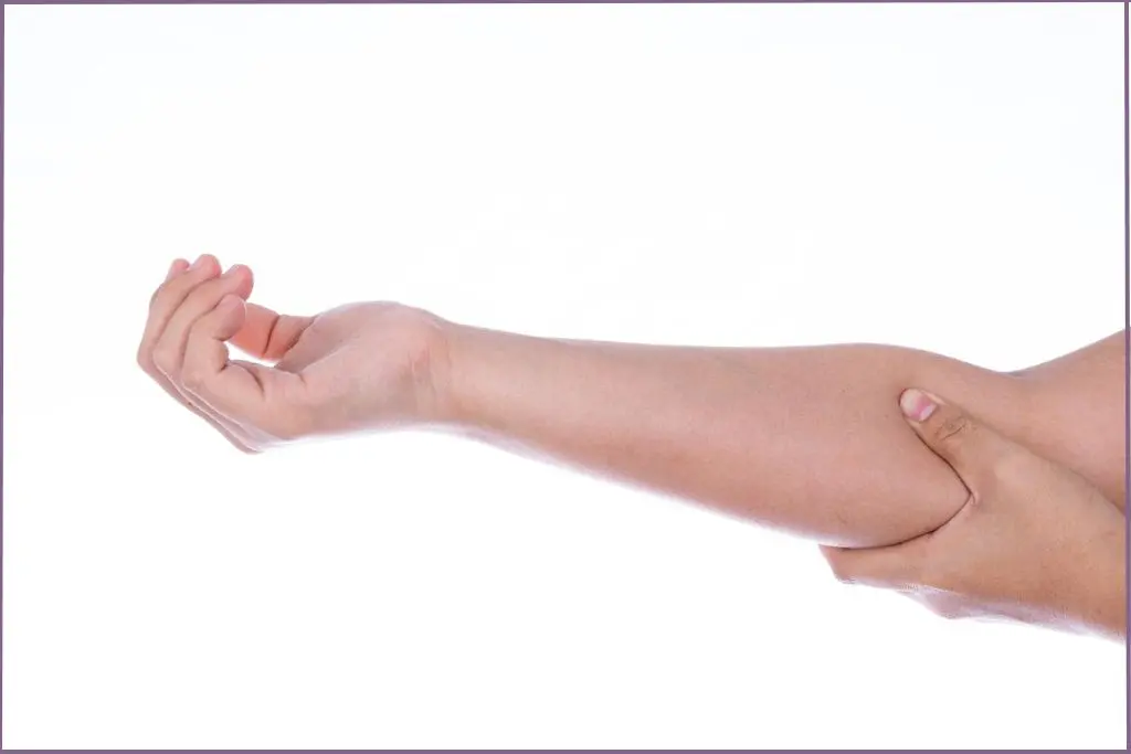 lady pointing to inside of elbow which is a good pulse point for essential oils