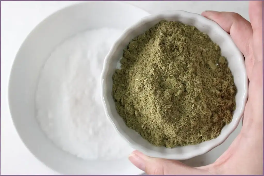 Adding powdered eucalyptus leaves and lavender flowers to baking soda and Epsom salt to make aromatherapy shower steamers