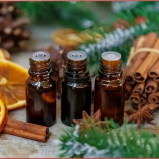 citrus and spice blend bottles with cinnamon, star anise and dried oranges