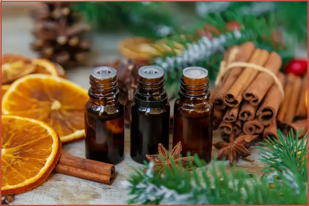 citrus and spice blend bottles with cinnamon, star anise and dried oranges