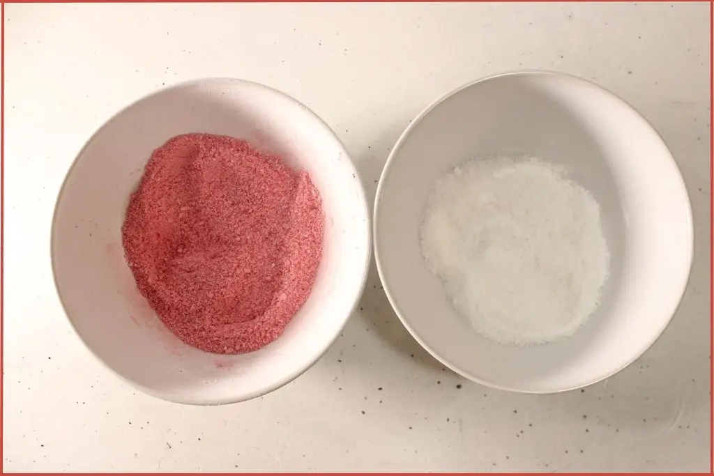 Two white bowls - one with red bath bomb mix and one with white, for making striped candy cane bath bombs