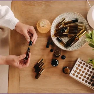 Aroma diffuser with assortment of essential oil bottles as part of an essential oil toolkit for peaceful holiday preparations