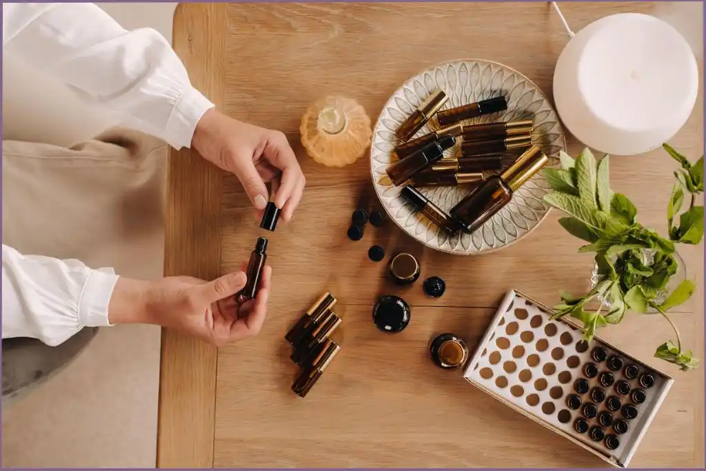 Aroma diffuser with assortment of essential oil bottles as part of an essential oil toolkit for peaceful holiday preparations