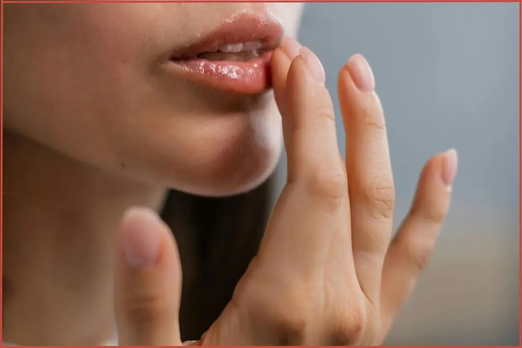 lady applying lip balm