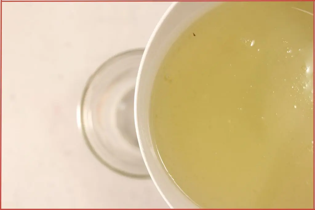 Pouring Castile soap into container with essential oil to scent foaming hand soap