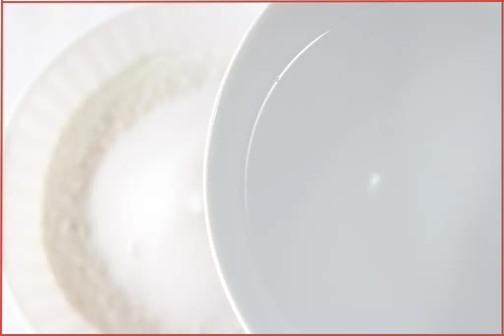 Adding water to dry ingredients to make essential oil diffuser ornaments for Christmas