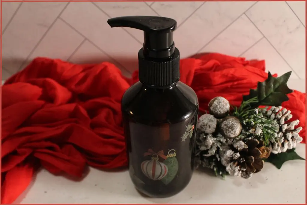 foaming soap dispenser bottle, dark colored, with red festive towel and Christmas decor with troubleshooting tips