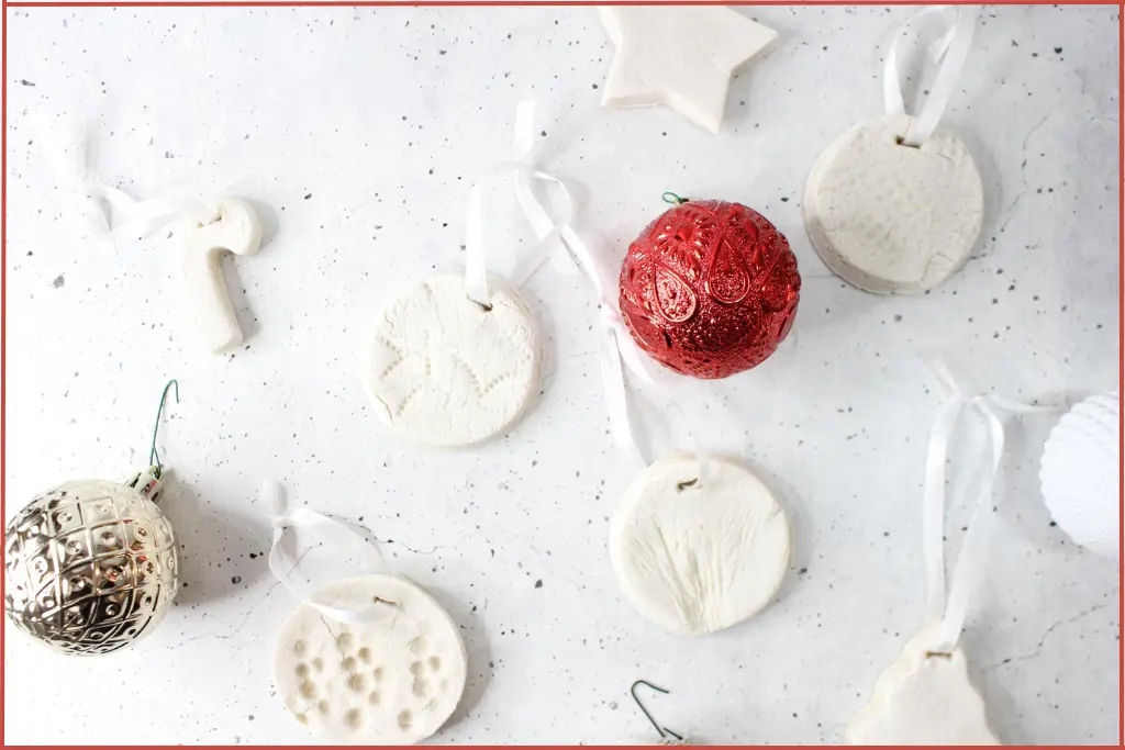 White salt dough Christmas diffuser ornaments in festive shapes with ribbon and red and white baubles - storage tips