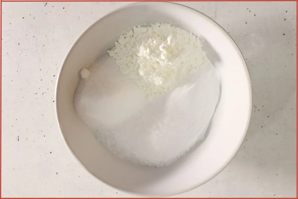 Bath bomb dry ingredients in a large white bowl.