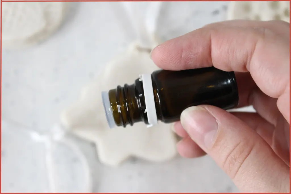 Add essential oil drops to scent homemade Christmas diffuser ornament