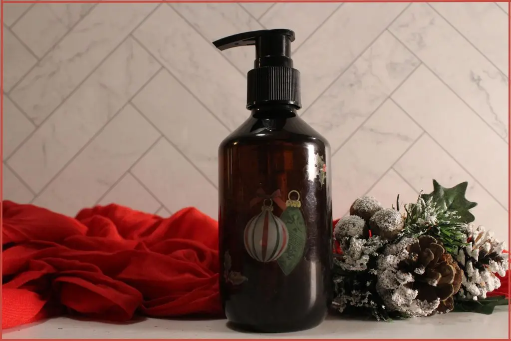 foaming soap dispenser bottle, dark colored, with red festive towel and Christmas decor with tips for success