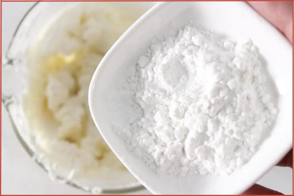 Putting arrowroot powder into melted cocoa butter and tallow to make Christmas hand cream