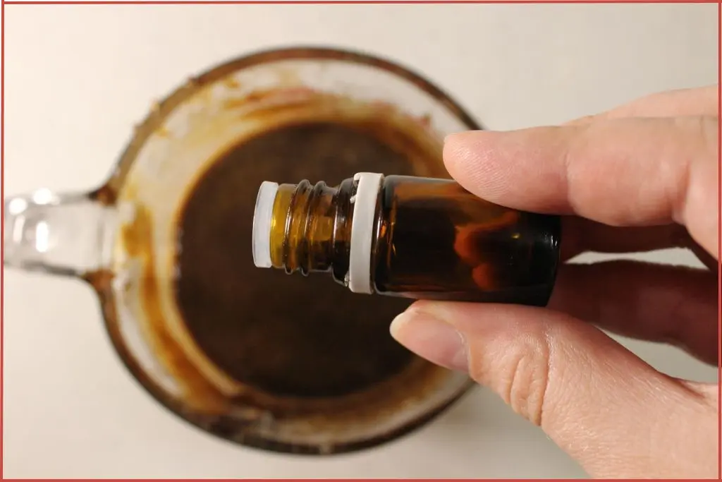 Adding essential oil blend to melted soap base to make gingerbread soap bars